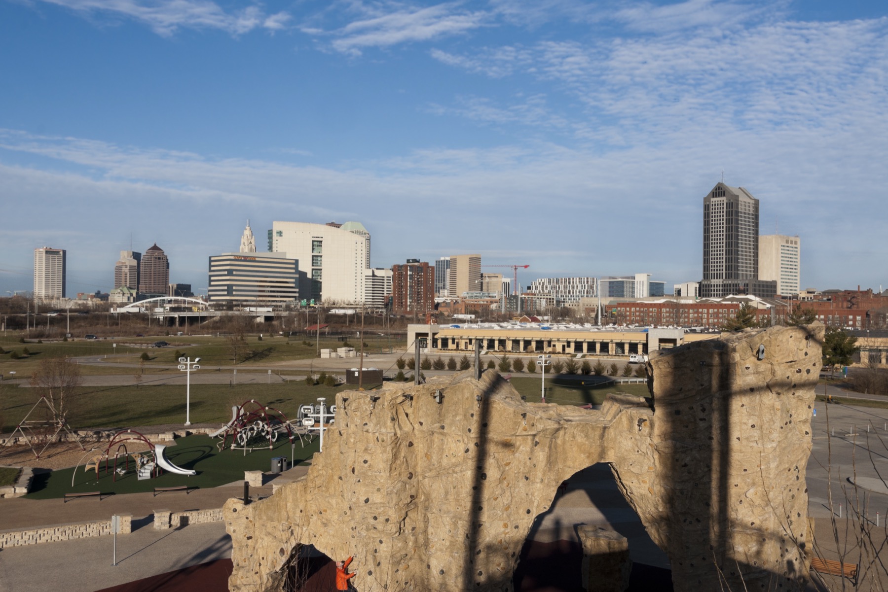 Downtown Columbus seen beyond the climbing wall at Scioto Audubon Metro Park