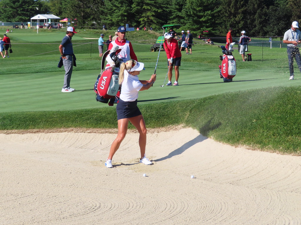 Players practicing bunker shots at Inverness Club during the 2021 Solheim Cup